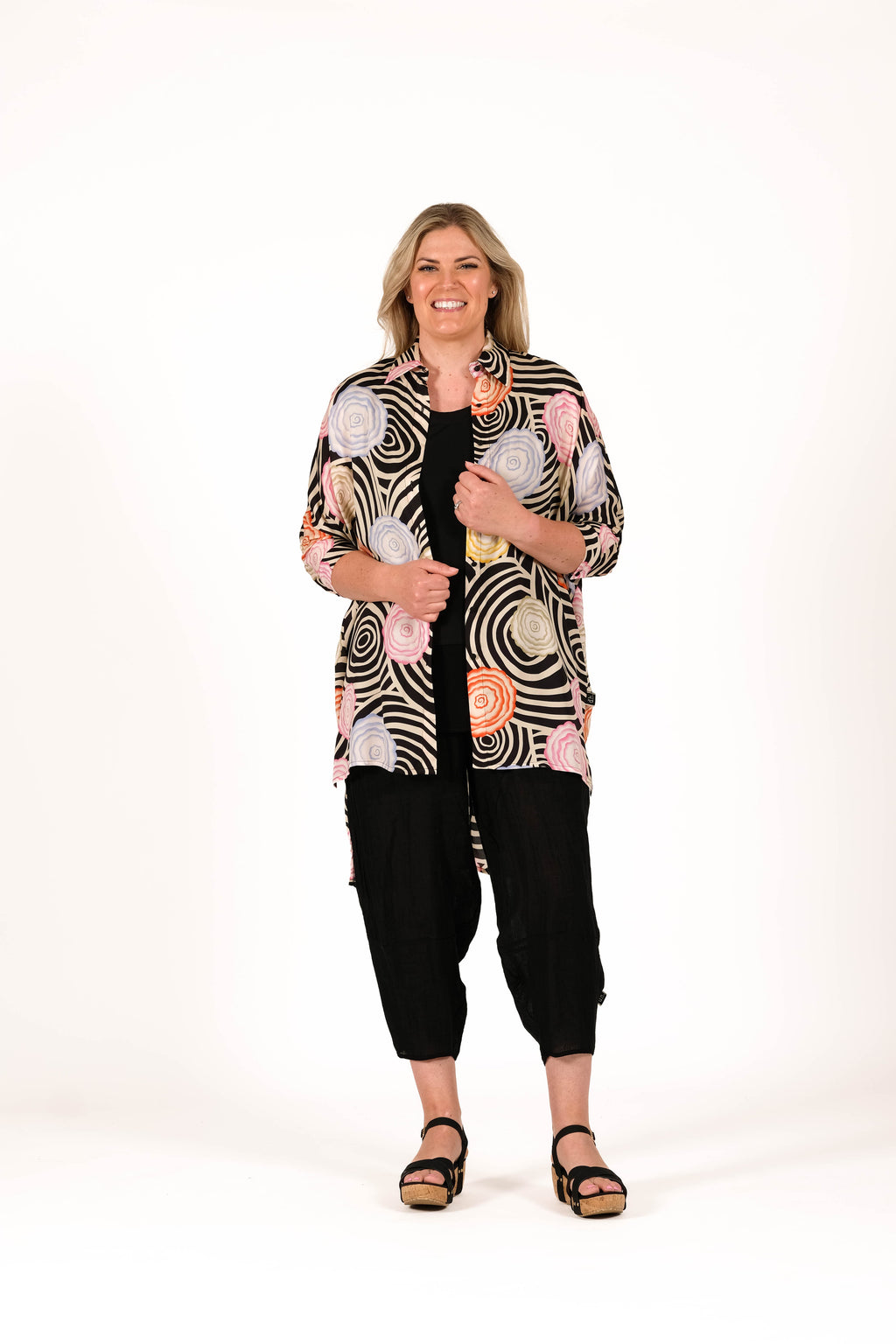 Relaxed, architectural, and effortlessly cool shirt. Featuring an oversized silhouette, soft collar detail, dropped sleeves, and a longer back hem for easy layering and movement. 