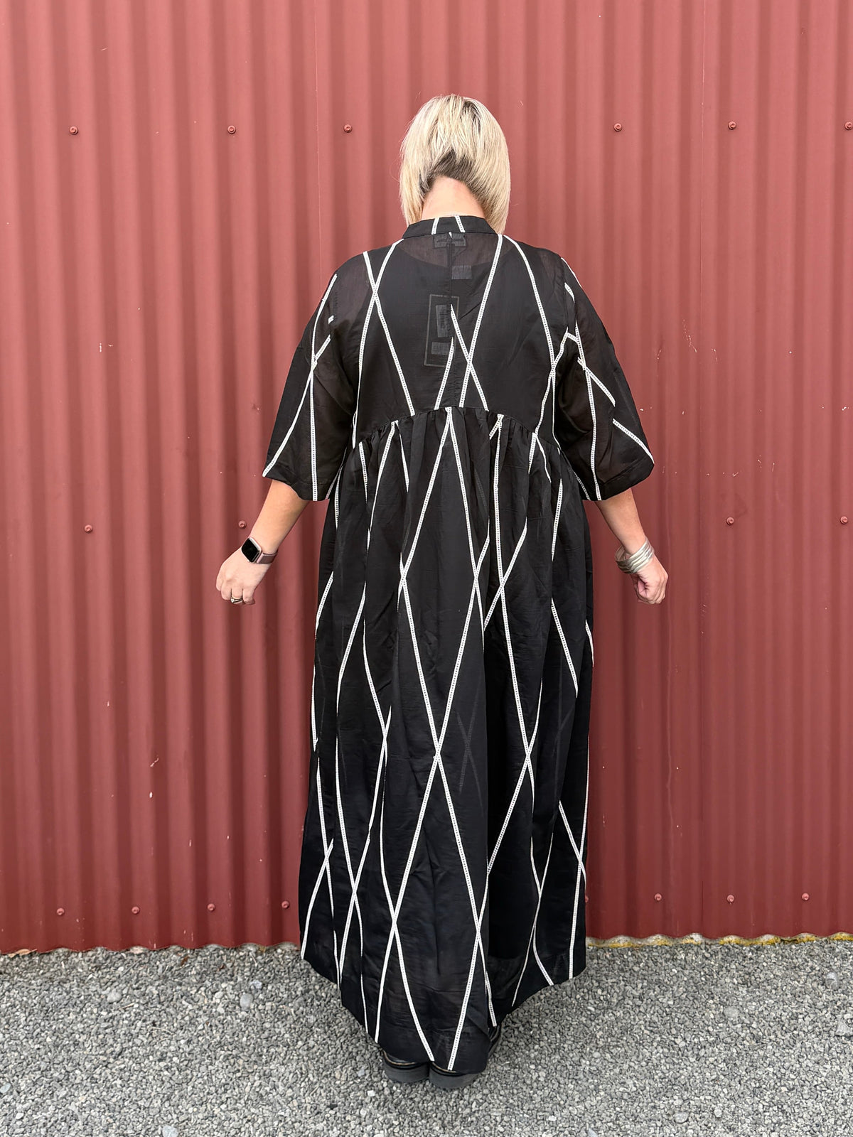 Relaxed and feminine Dress with soft volume and beautiful movement through the skirt.   Fabric ,Tencel By Deeanne Hobbs