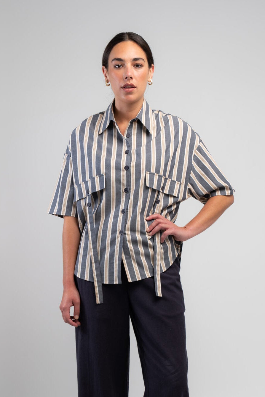 The Obi Diva Stripe Shirt is crafted from 100% cotton in a relaxed boyfriend fit, featuring flattering vertical stripes in navy, stone and soft grey with stylish pocket and tab detailing.
Finished with a classic collar, button-through front and curved hem for an effortlessly modern look. Sizes 14–22.