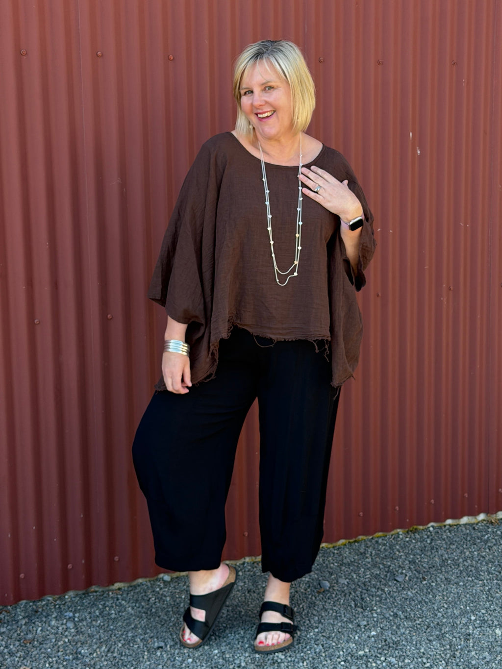 Cotton gauze tunic top. 100% breathable cotton, it's got an oversized fit, wide draped sleeves, and an asymmetrical frayed hem for that relaxed, lived-in vibe. Label: CINDY G