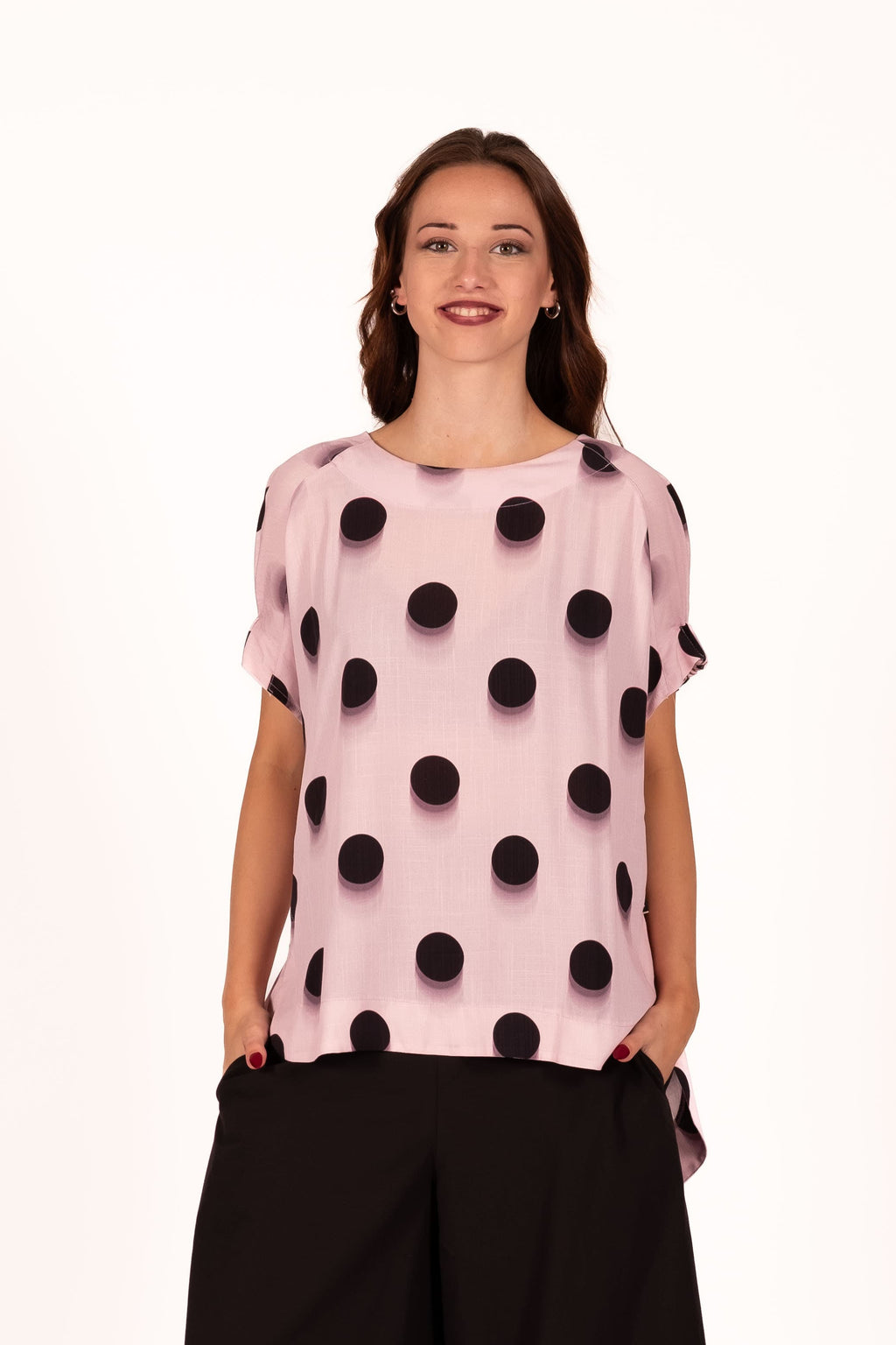 Relaxed and contemporary with soft sculptural volume Top. Featuring wide draped shaping through the body, elasticated gathered arm detailing, and a softly curved hemline for effortless movement and edge. 