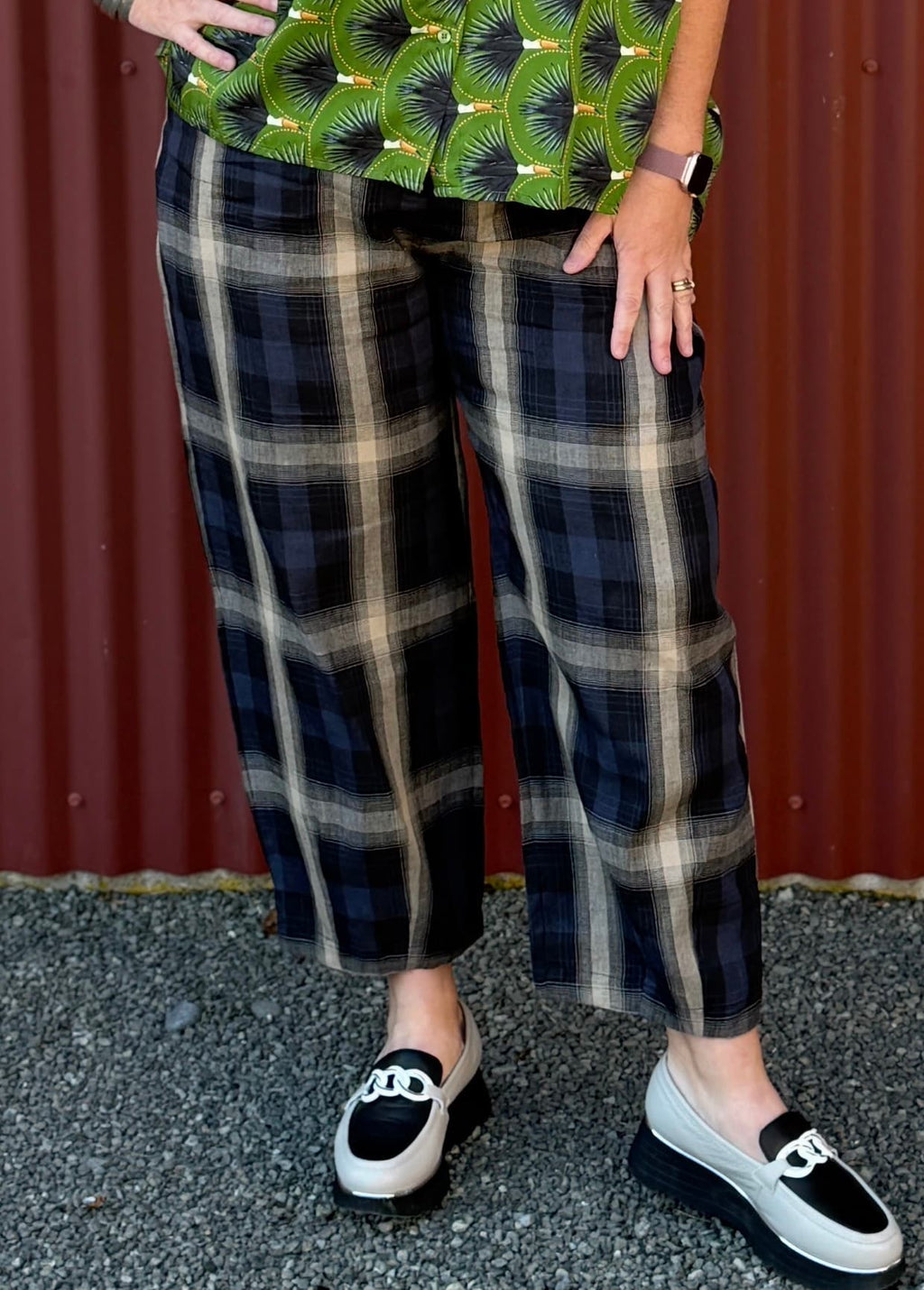 The OBI Marakesh Check Devon Pant features a relaxed tapered leg, flat waistband and side pockets in a navy, stone and beige linen-cotton blend. A modern style.