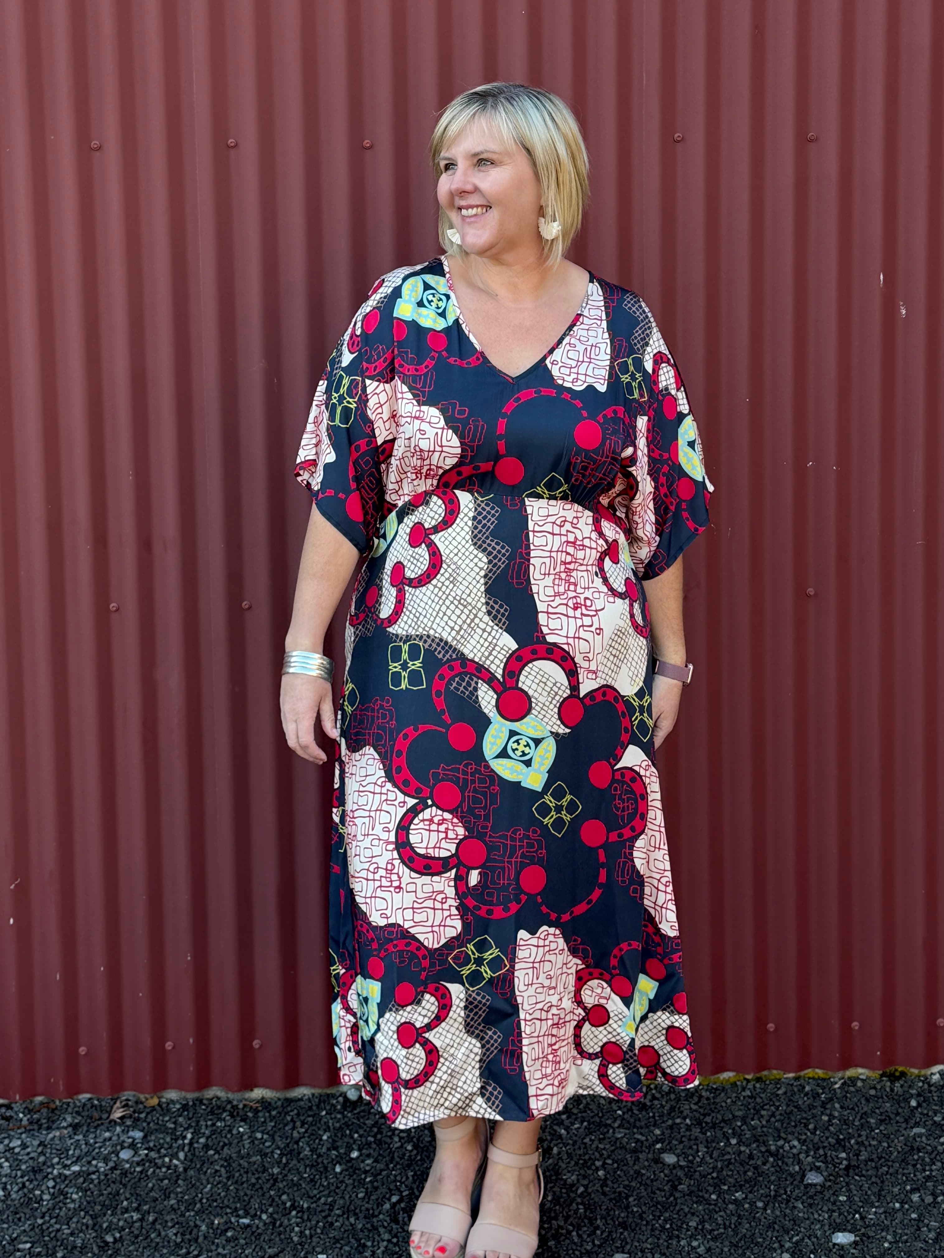 OBI Marakesh Shift Dress in a vibrant print with flattering A-line shape, V-neck, relaxed sleeves and side pockets. 100% Viscose. Sizes 16–22.