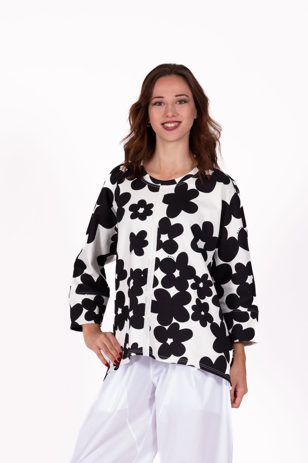 Relaxed and effortlessly cool with an oversized cocoon silhouette sweatshirt . Featuring dropped shoulders, wide statement sleeves, side splits, and a curved hemline 