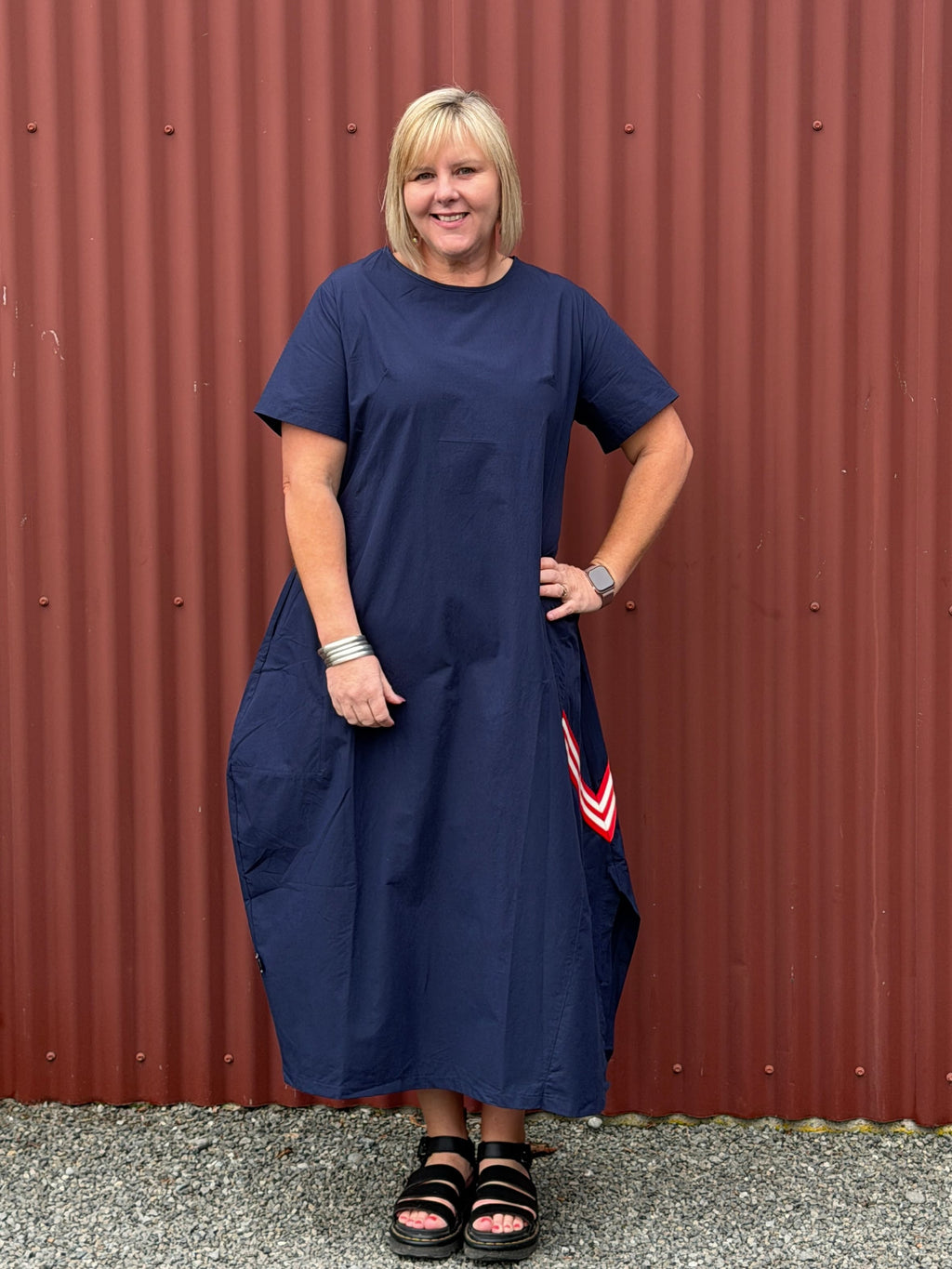 A crisp cotton look with a sporty modern edge, combining clean simplicity with relaxed everyday ease.

Relaxed and sculptural with soft shaping through the body. Featuring angled seam detailing, inset pockets, and subtle cocoon shaping that creates beautiful movement when worn. Finished with soft back elastic adjustable detailing for gentle shape and an effortless everyday feel with edge.
Designed in New Zealand for real women.

Fabric- Cotton