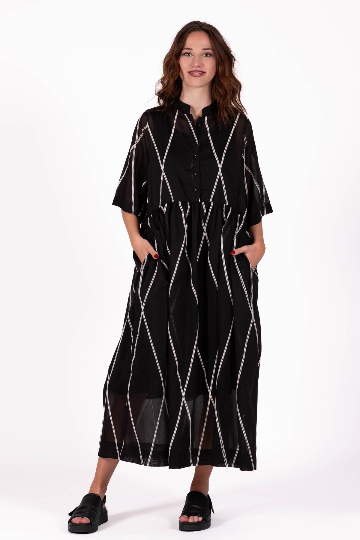 Relaxed and feminine Dress with soft volume and beautiful movement through the skirt.   Fabric ,Tencel By Deeanne Hobbs