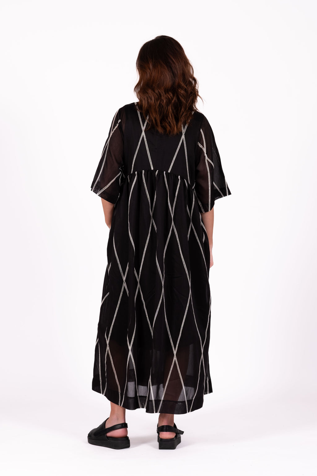 Relaxed and feminine Dress with soft volume and beautiful movement through the skirt.   Fabric ,Tencel By Deeanne Hobbs