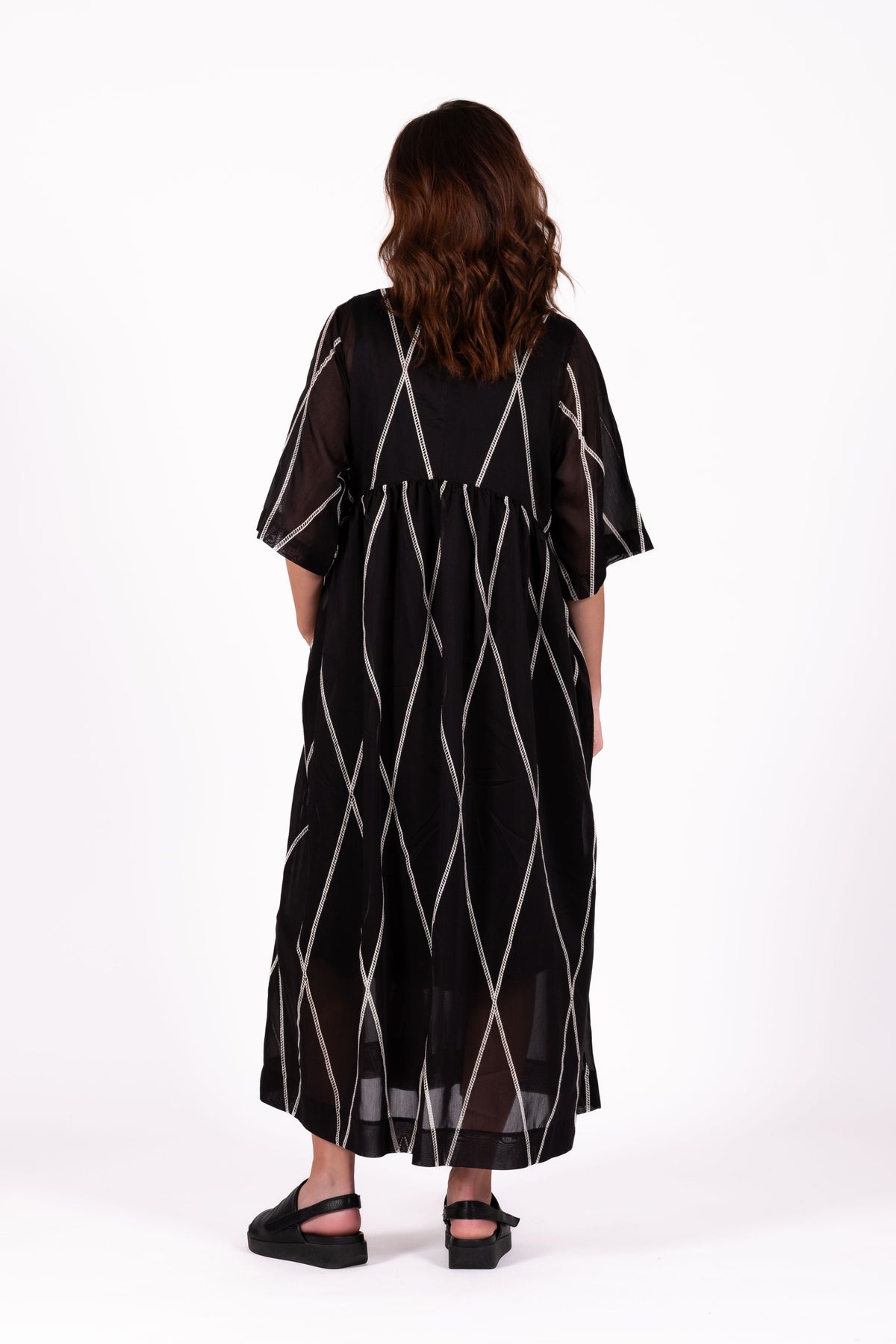Relaxed and feminine Dress with soft volume and beautiful movement through the skirt.   Fabric ,Tencel By Deeanne Hobbs