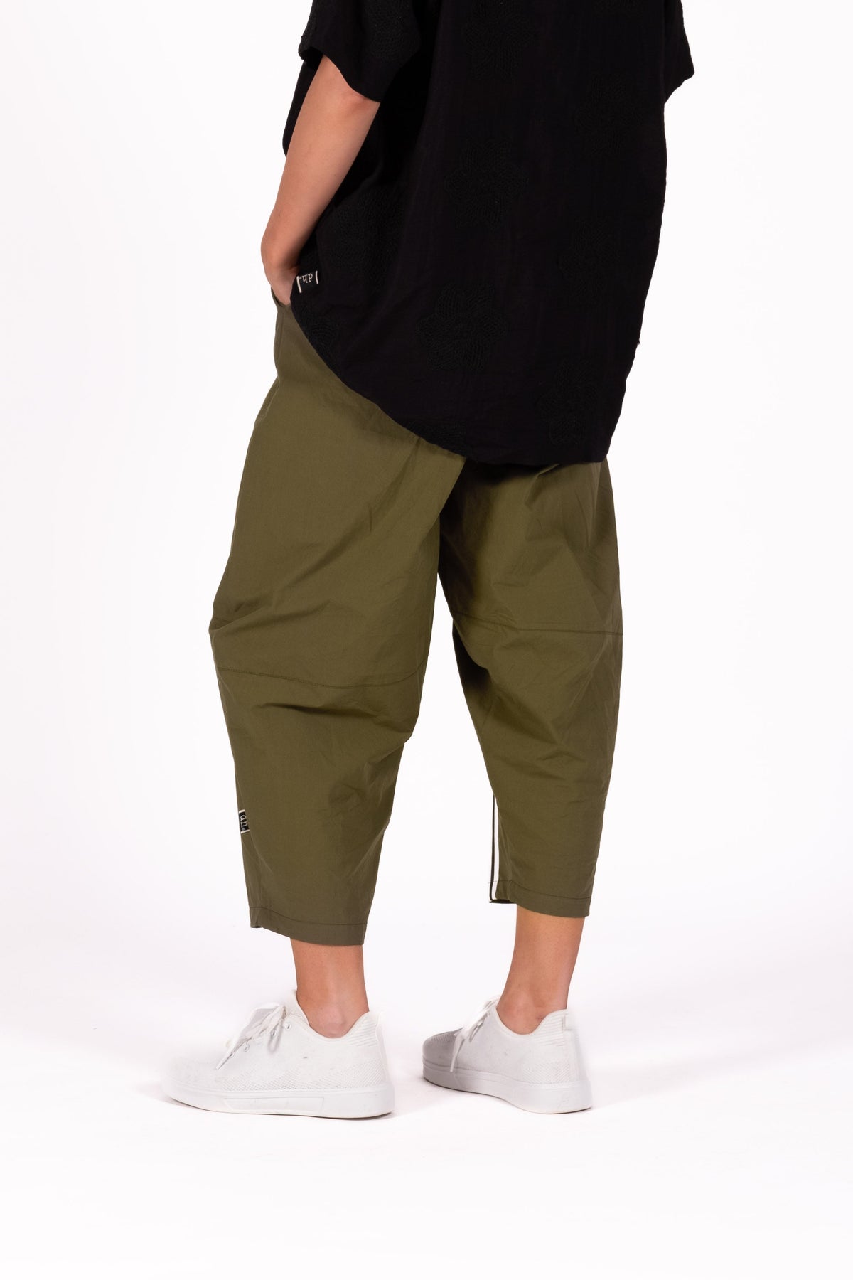 Relaxed and sculptural Pants with a softly tapered silhouette. Featuring statement seam detailing through the leg, and elasticated waistband.By Deeanne Hobbs 