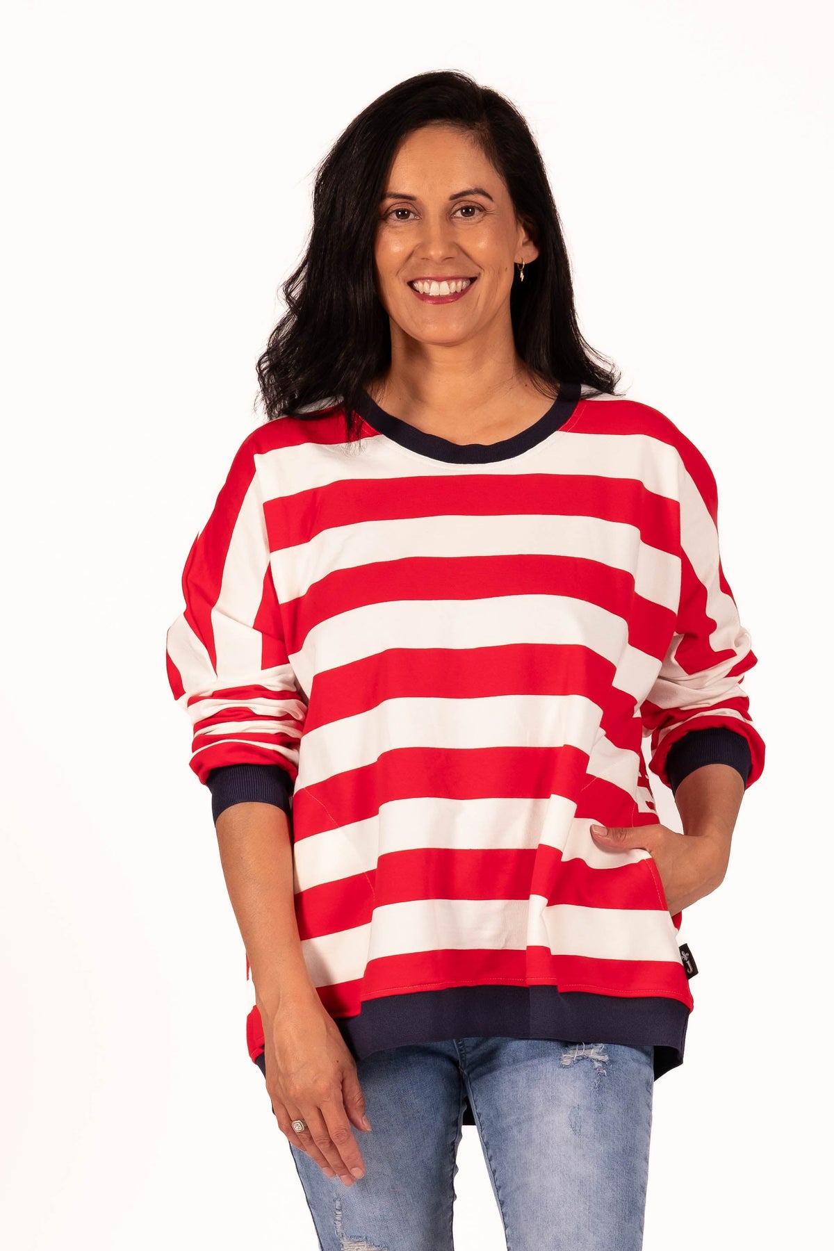 Classic with a sporty modern edge. This relaxed striped sweatshirt combines effortless everyday comfort with clean graphic lines and vibrant contrast detailing for an easy statement look. By Jellicoe