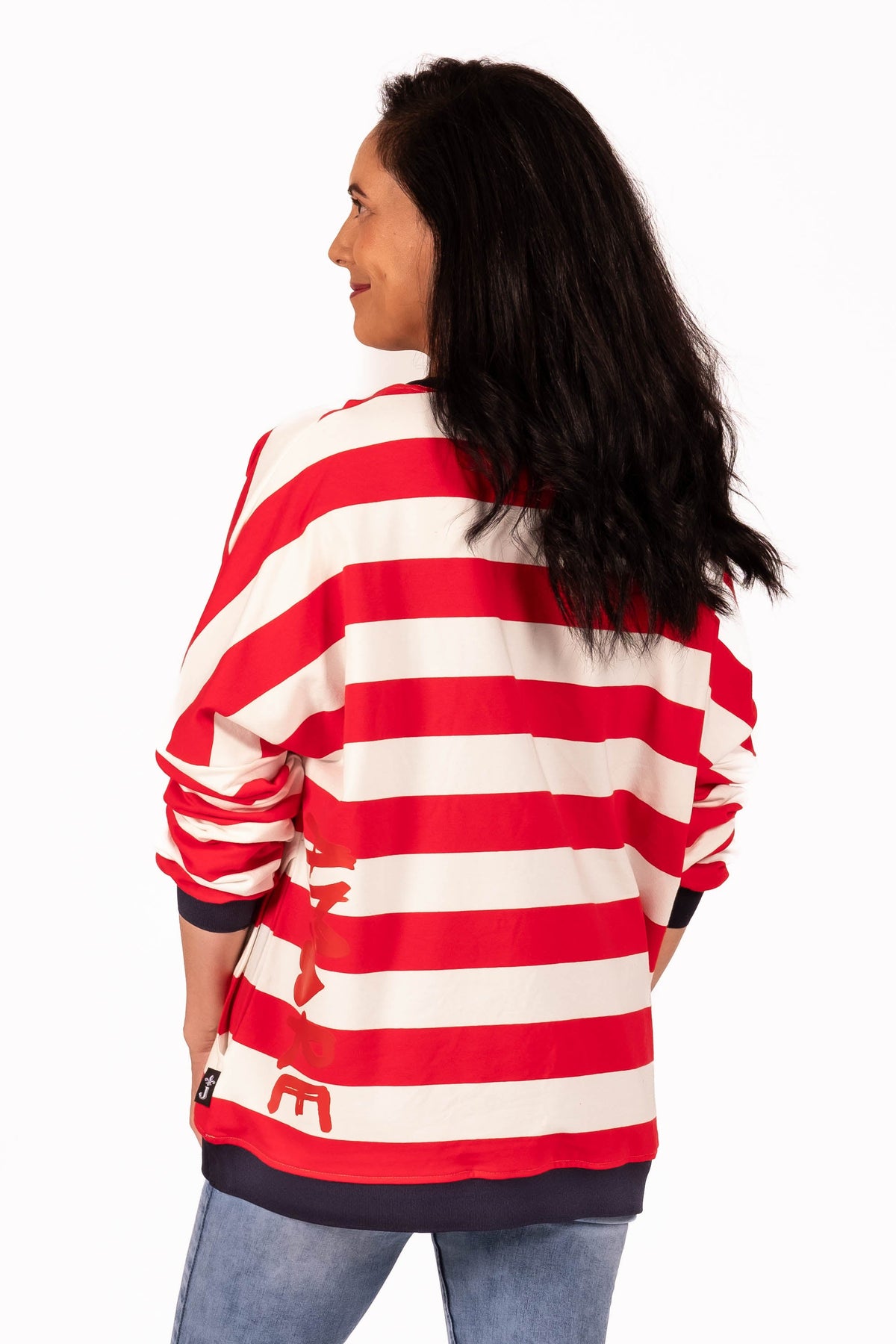 Classic with a sporty modern edge. This relaxed striped sweatshirt combines effortless everyday comfort with clean graphic lines and vibrant contrast detailing for an easy statement look. By Jellicoe