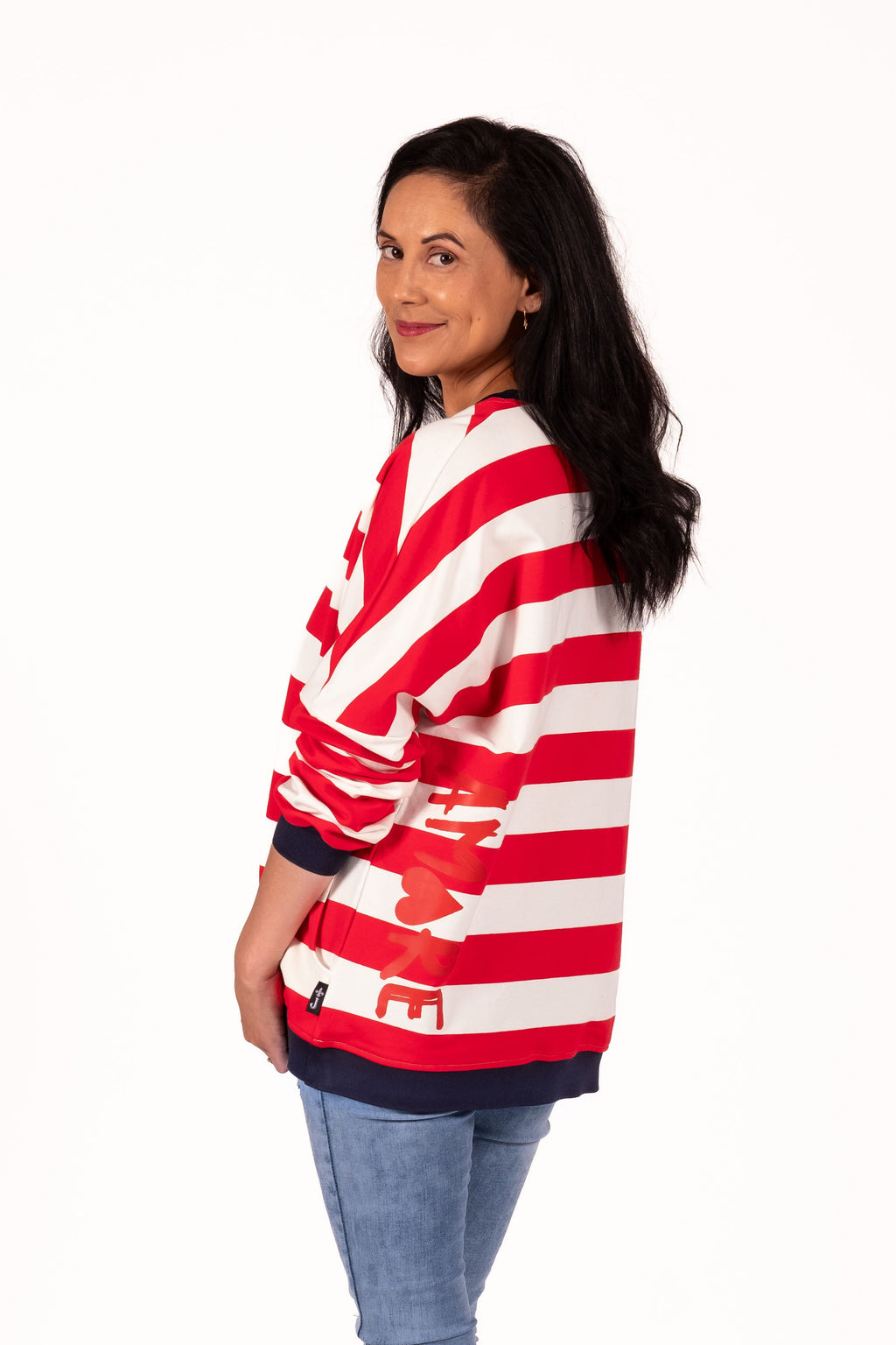 Classic with a sporty modern edge. This relaxed striped sweatshirt combines effortless everyday comfort with clean graphic lines and vibrant contrast detailing for an easy statement look. By Jellicoe