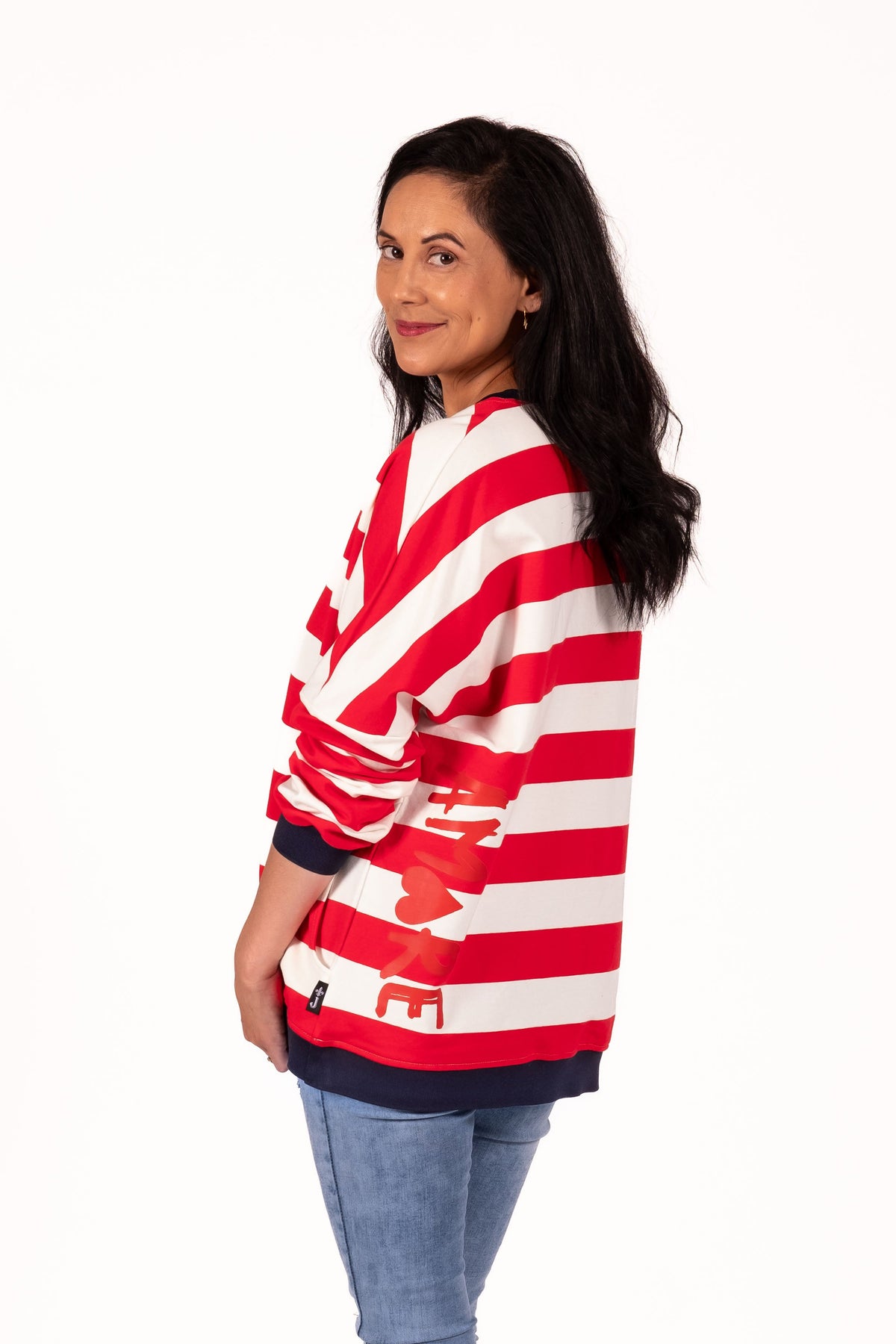 Classic with a sporty modern edge. This relaxed striped sweatshirt combines effortless everyday comfort with clean graphic lines and vibrant contrast detailing for an easy statement look. By Jellicoe