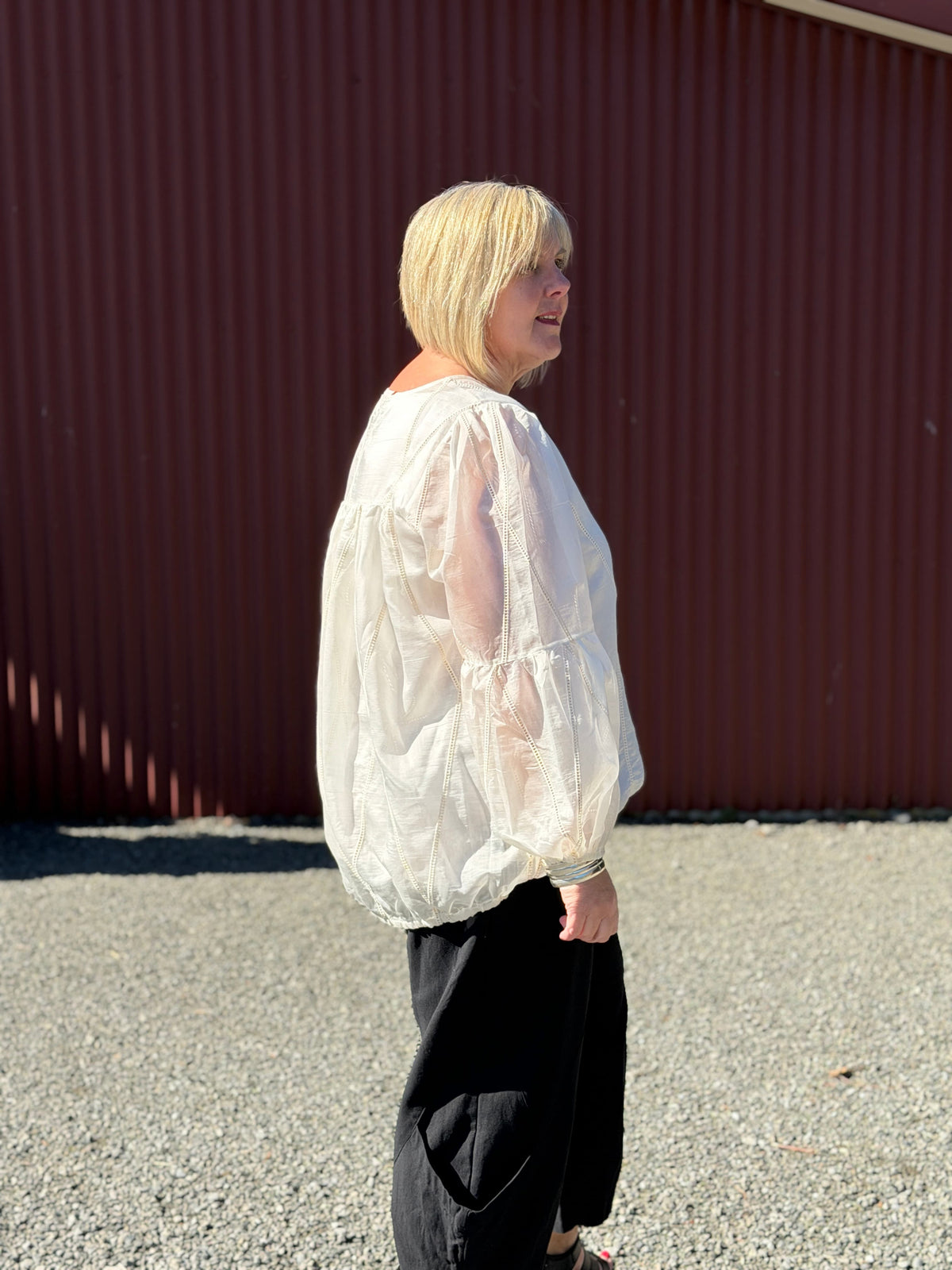 A soft sheer ivory fabric with delicate stitched detailing, creating an elegant romantic look with effortless femininity. Softly structured with an effortless relaxed fit. 