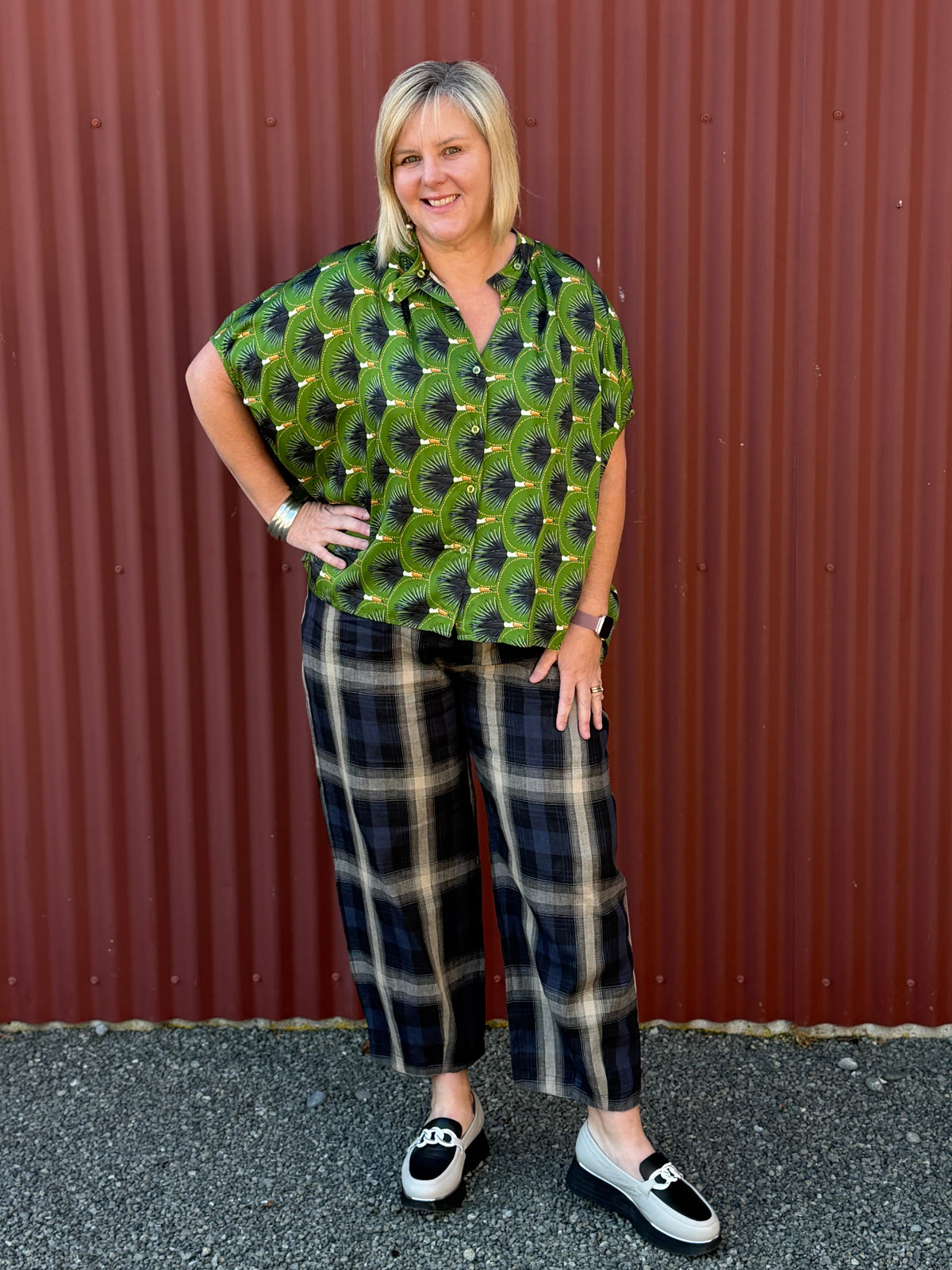 The OBI Marakesh Check Devon Pant features a relaxed tapered leg, flat waistband and side pockets in a navy, stone and beige linen-cotton blend. A modern style.