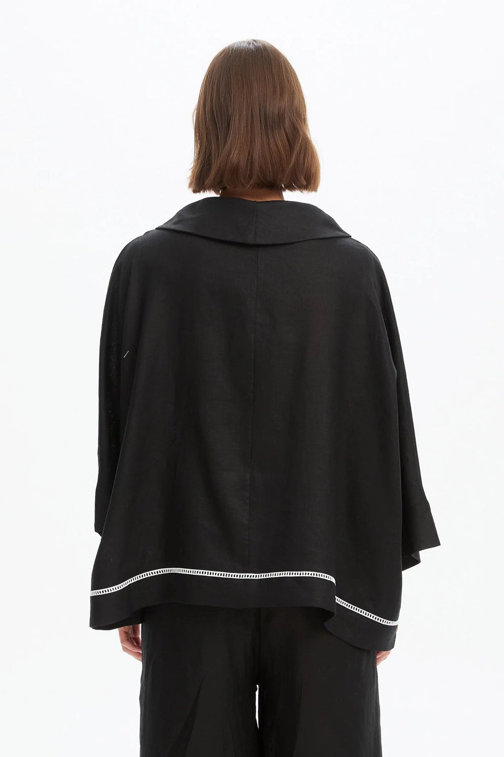 The Ladder Hem Cowl Neck Top brings a directional edge to everyday dressing with its considered, modern silhouette. Designed in a relaxed boxy fit, it features a soft cowl neckline and an asymmetric wrap front that creates subtle shape and movement. By Tirelli
